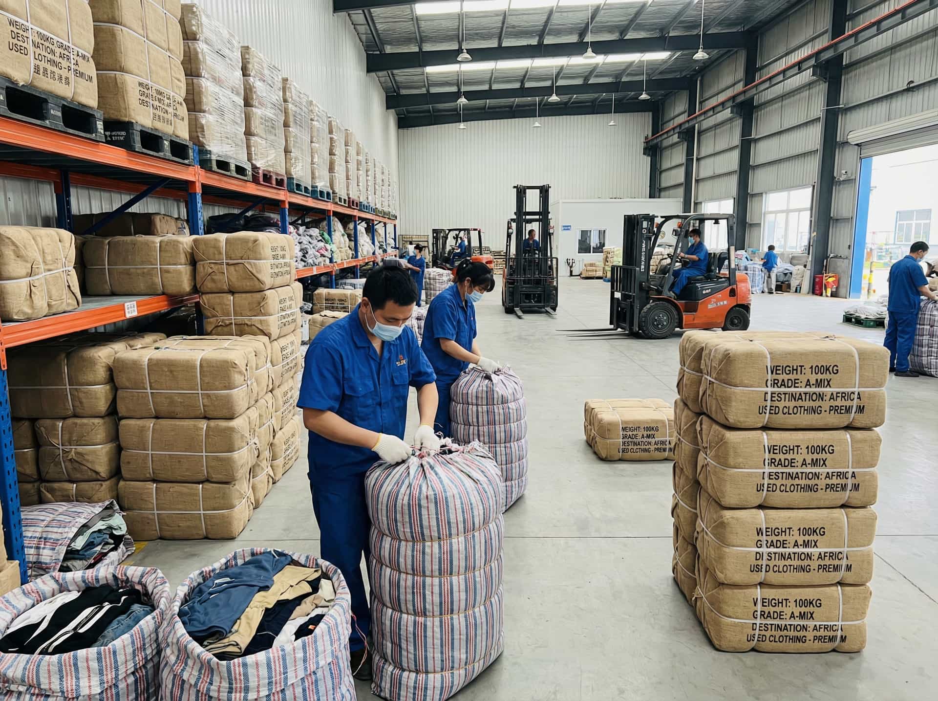 RealismThrift Secure Packing Process - Compressed Bales of Second Hand Clothes for Global Shipping